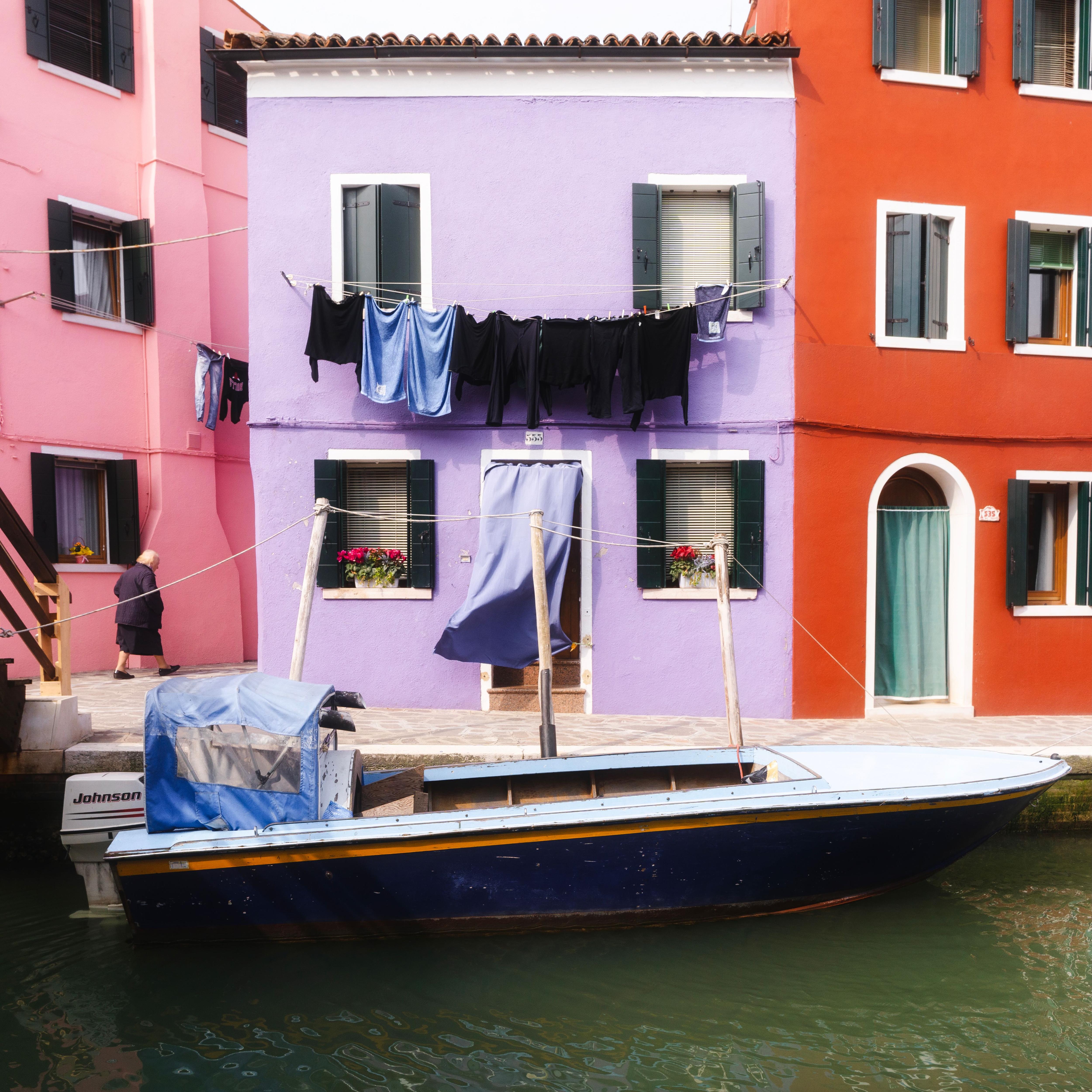 The houses of Burano were all vibrant. This one matches the colors of the boat in front of it!